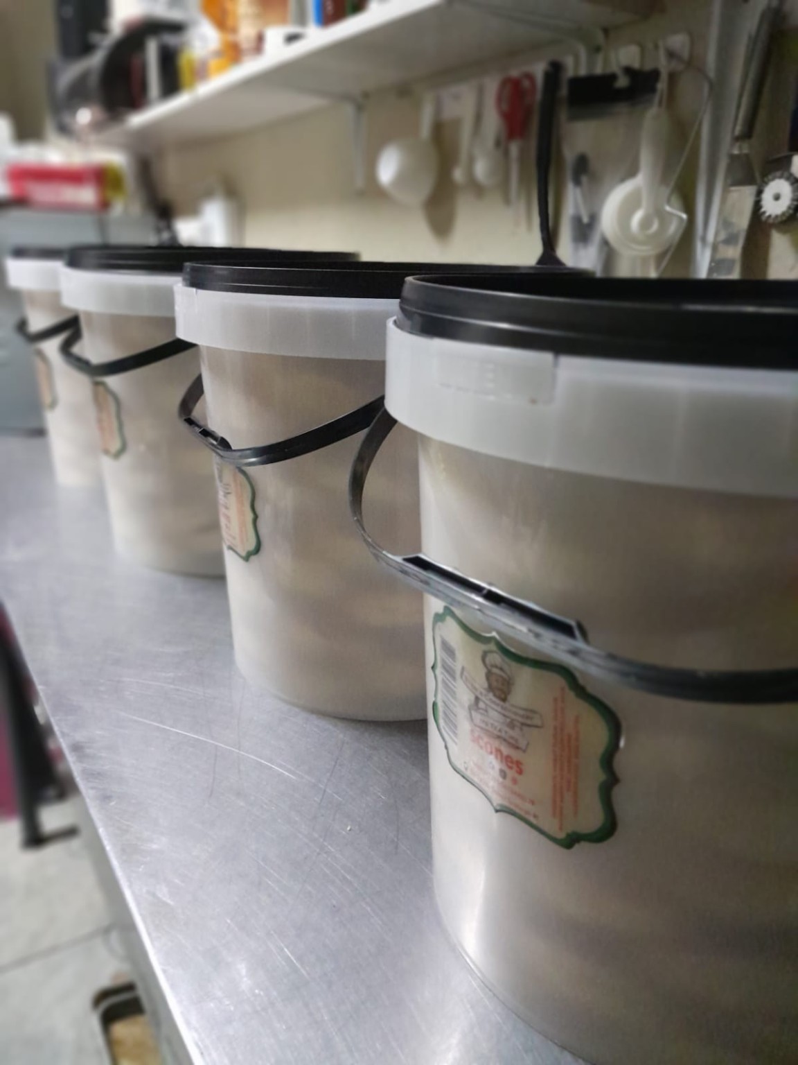 Several large buckets of signature scones prepared for customers