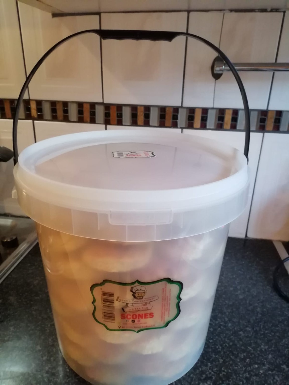 A large bucket filled with signature scones